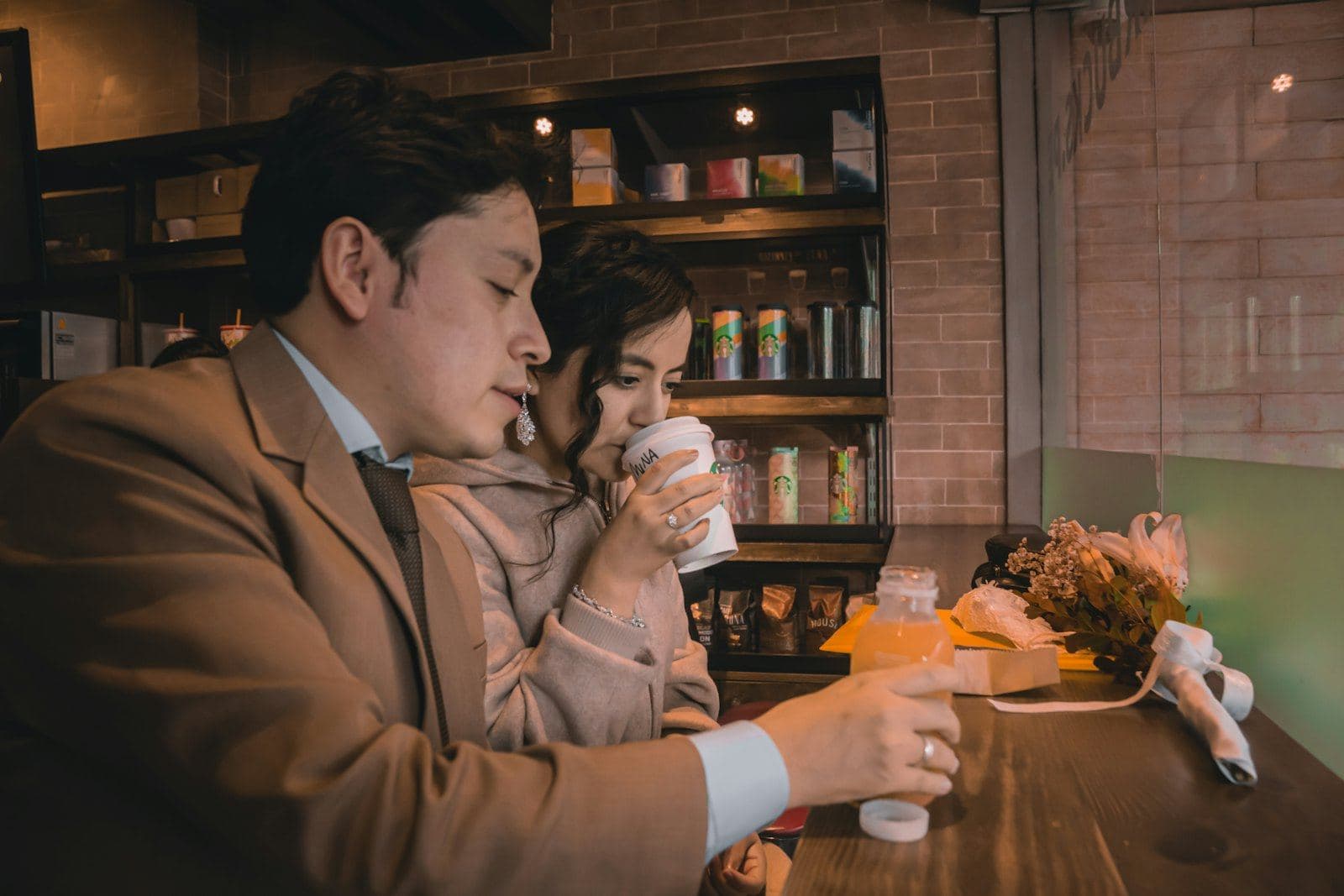 A couple talking over coffee in a quiet café