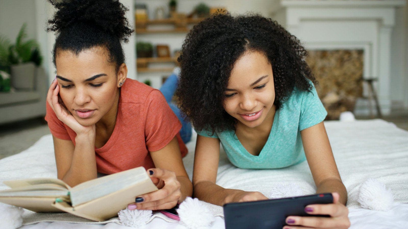 A mother and daughter relaxing and reading together